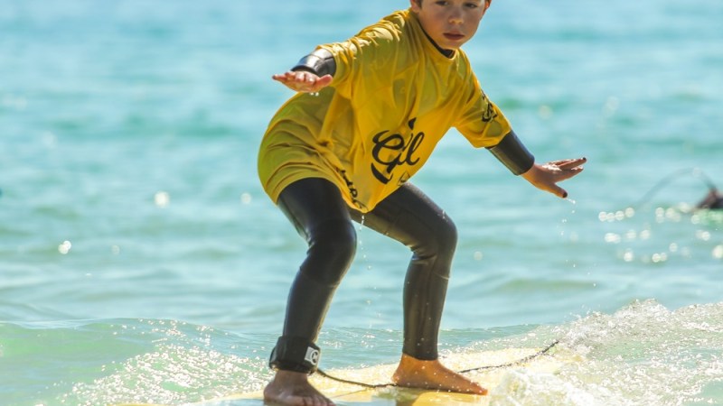 a person riding a surf board in the water