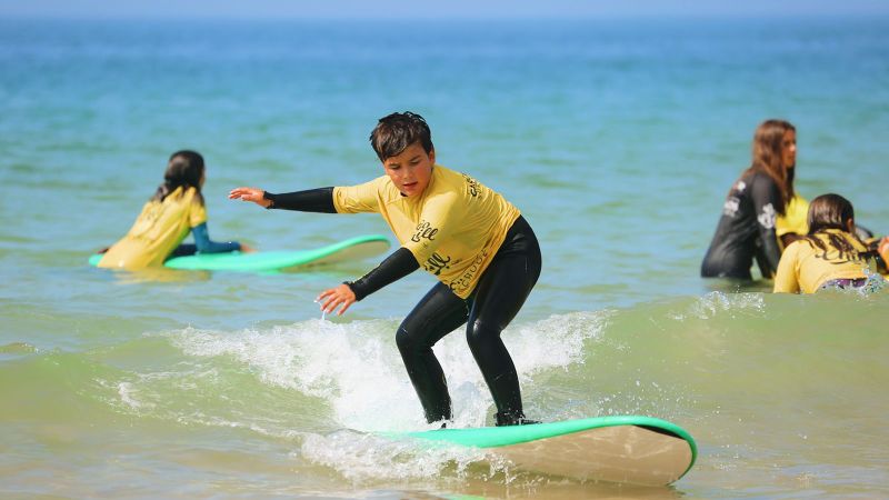 a person riding a wave on a surfboard in the ocean