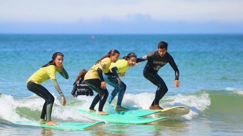 a person riding a wave on a surfboard in the water