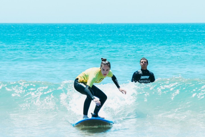 a man riding a wave on a surfboard in the ocean
