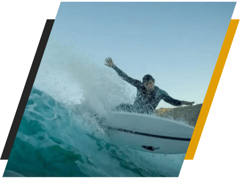 team5 a man riding a wave on a surfboard in the water