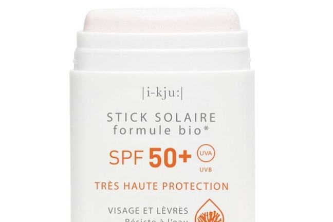 Sun protection stick with SPF 50+ for face and lips, in white and orange design.